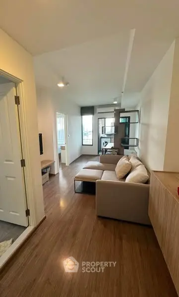 Modern living room with sleek design and cozy seating area