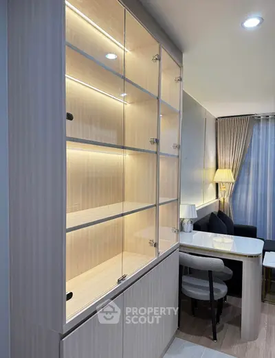 Modern living room with elegant glass cabinet and cozy dining area