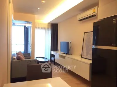 Modern living room with sleek furniture and air conditioning in a stylish apartment.