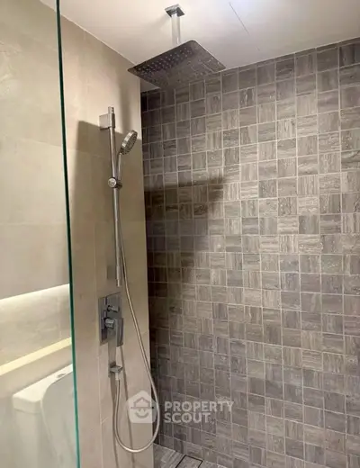 Modern bathroom with stylish shower and elegant tile design