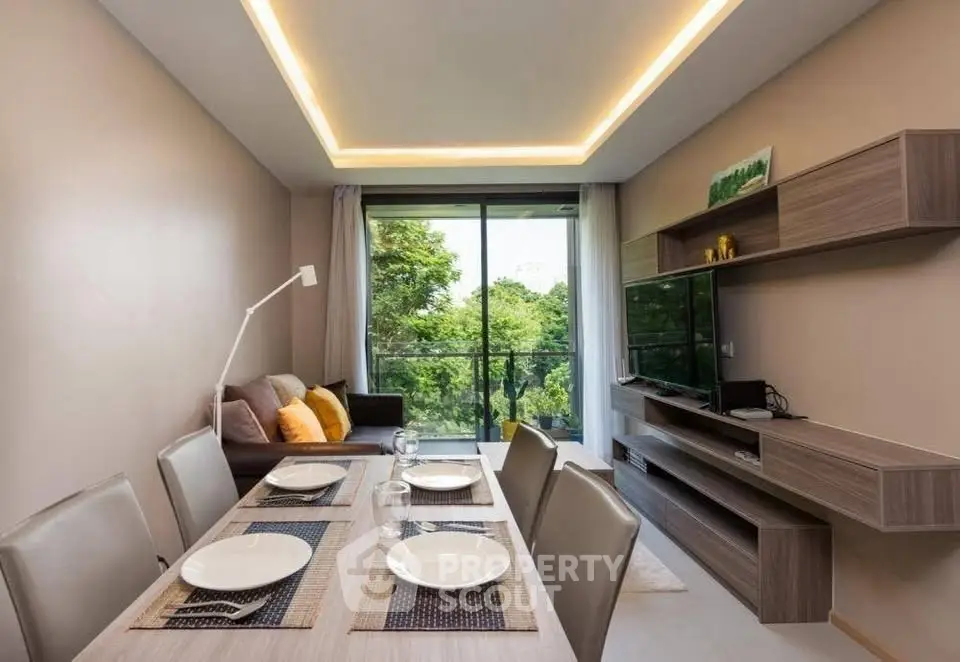 Modern living room with elegant dining area and scenic balcony view