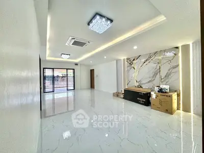 Spacious modern living room with marble flooring and elegant lighting