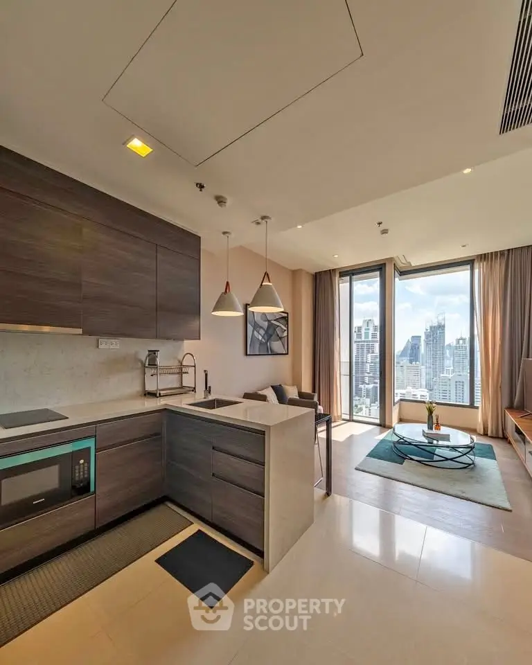 Modern open-layout kitchen and living room with city view in luxury apartment