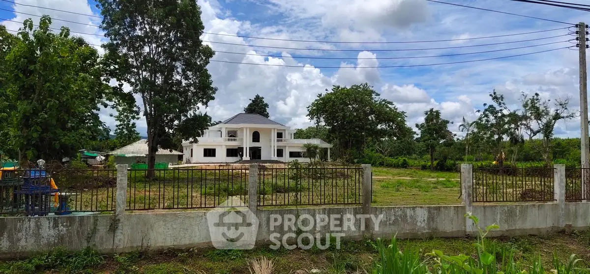 Stunning countryside estate with lush greenery and spacious grounds, perfect for serene living.