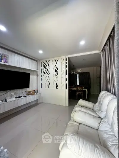 Modern living room with sleek decor and cozy seating area