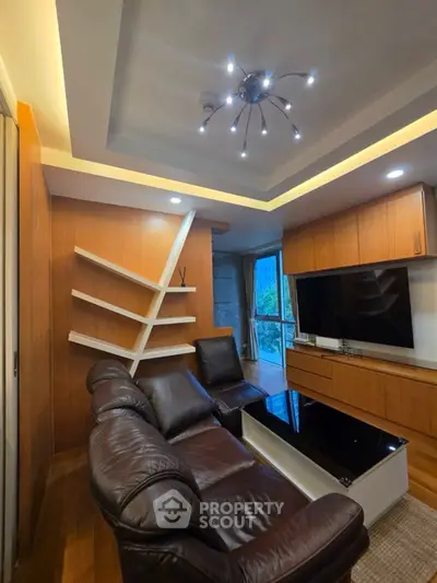 Modern living room with leather sofa and stylish lighting