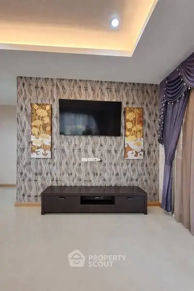 Elegant living room with modern TV setup and stylish decor