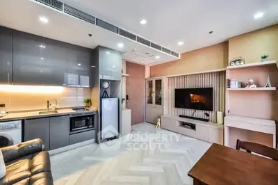 Modern open-layout living room with sleek kitchen and stylish decor
