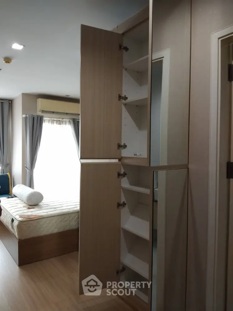 Modern bedroom with open wardrobe and natural light
