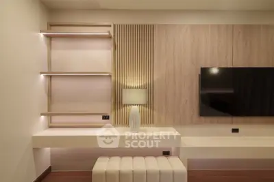 Modern living room with stylish wooden paneling and mounted TV
