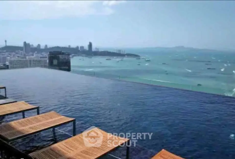 Stunning infinity pool with breathtaking ocean view and city skyline