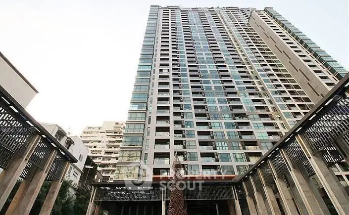 Stunning high-rise building exterior with modern architectural design and expansive windows.