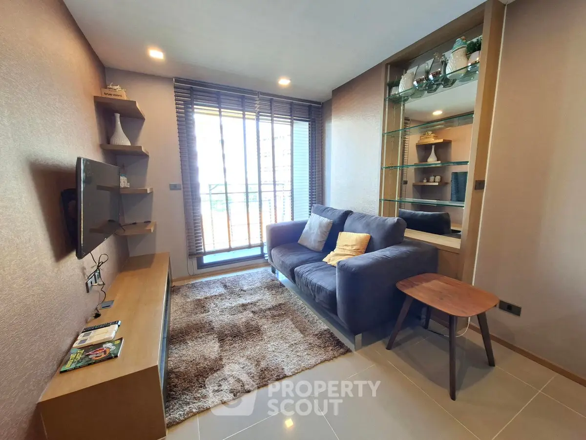 Modern living room with cozy sofa and stylish decor in a bright apartment.