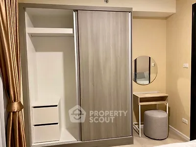 Modern bedroom with sleek wardrobe and stylish vanity area
