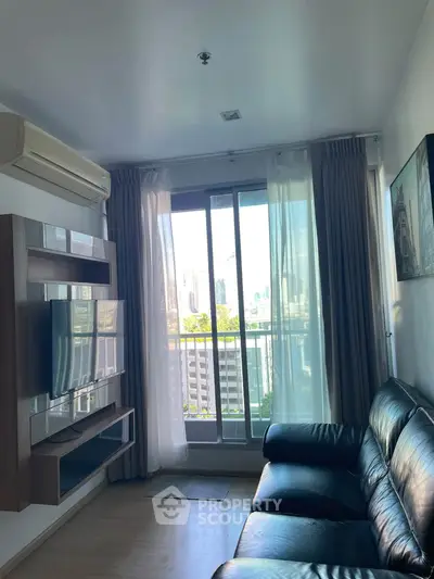 Modern living room with city view, leather sofa, and wall-mounted TV in a high-rise apartment.