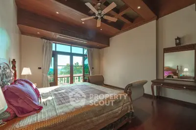 Luxurious bedroom with wooden ceiling and large window offering stunning views