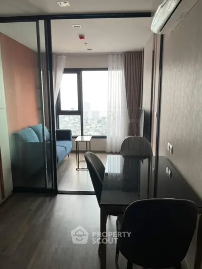 Modern living room with glass partition and city view