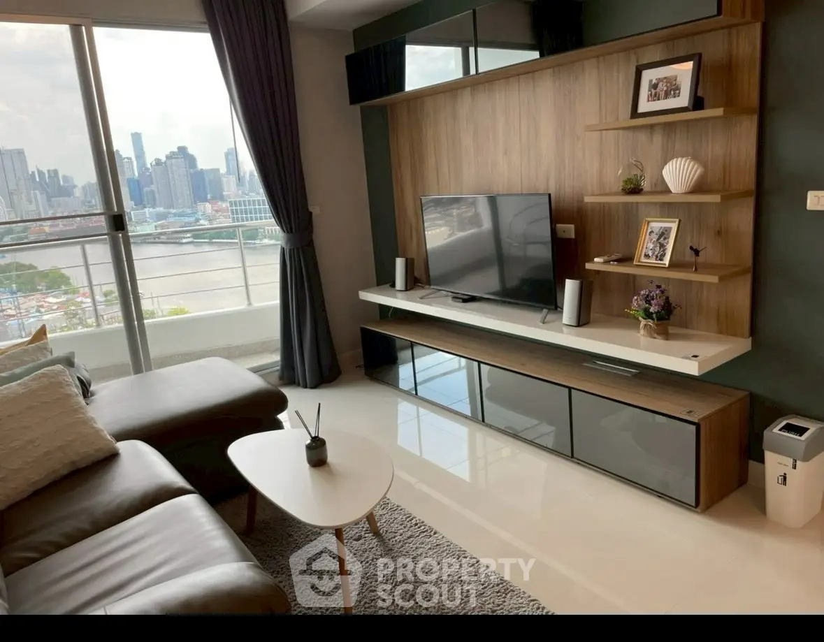 Modern living room with city view, sleek furniture, and stylish decor