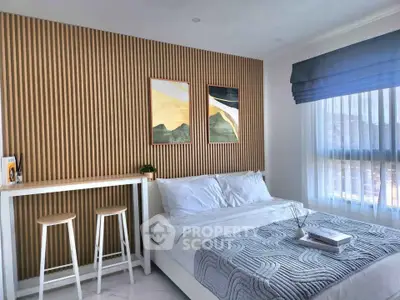 Modern bedroom with stylish wood paneling and cozy decor