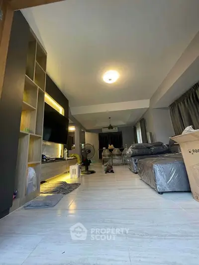 Spacious modern living room with sleek design and ample natural light
