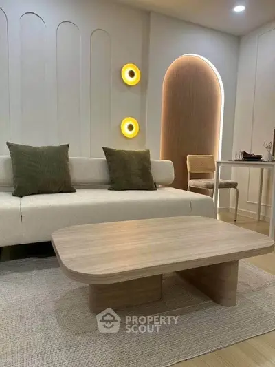 Modern living room with stylish sofa, wooden coffee table, and ambient lighting