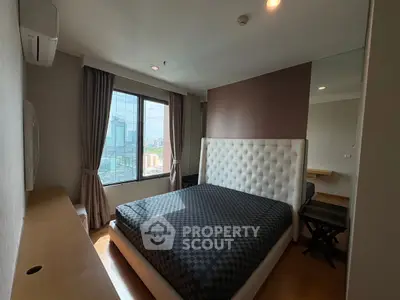 Modern bedroom with city view and stylish decor