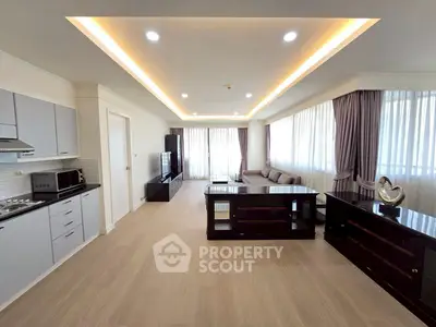 Spacious modern living room with elegant decor and ample natural light