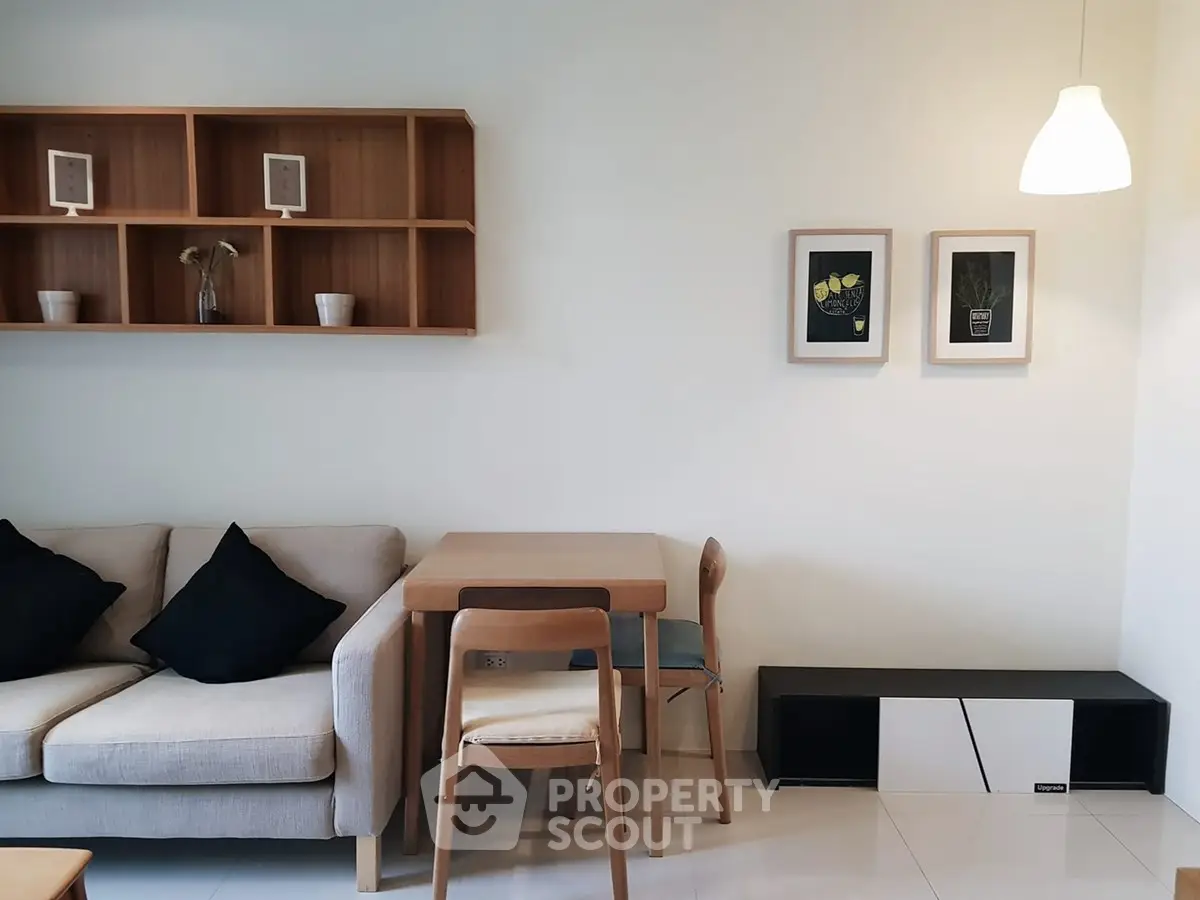 Modern living room with stylish furniture and elegant wall decor