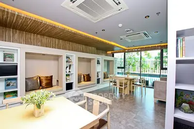 Modern communal living space with stylish seating and natural light