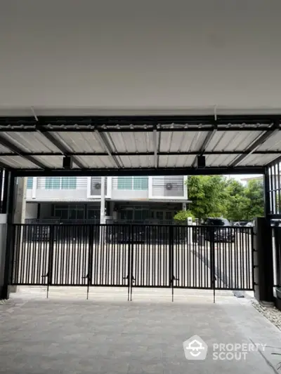 Modern gated entrance with sleek design and secure features