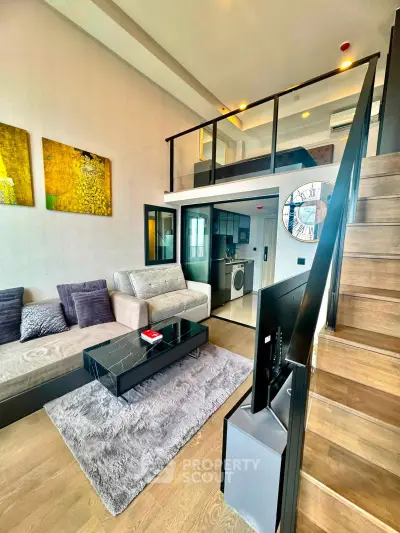 Modern loft-style living room with mezzanine, sleek furniture, and stylish decor.