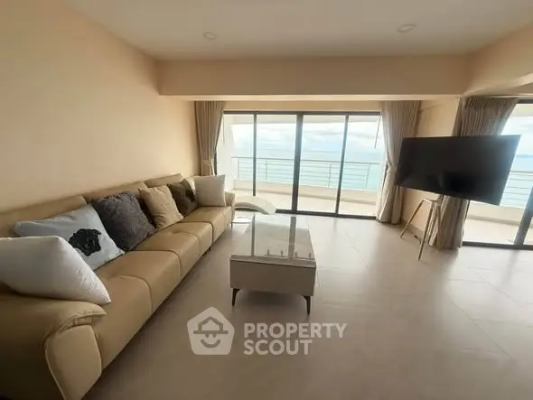 Spacious living room with ocean view and modern furnishings