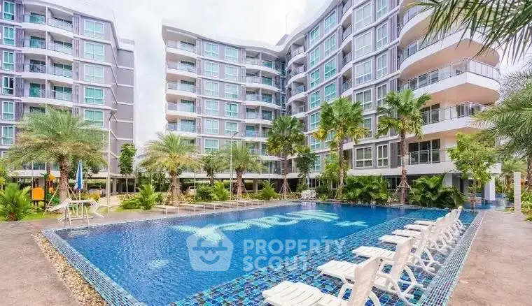 Modern condominium with pool and lush landscaping