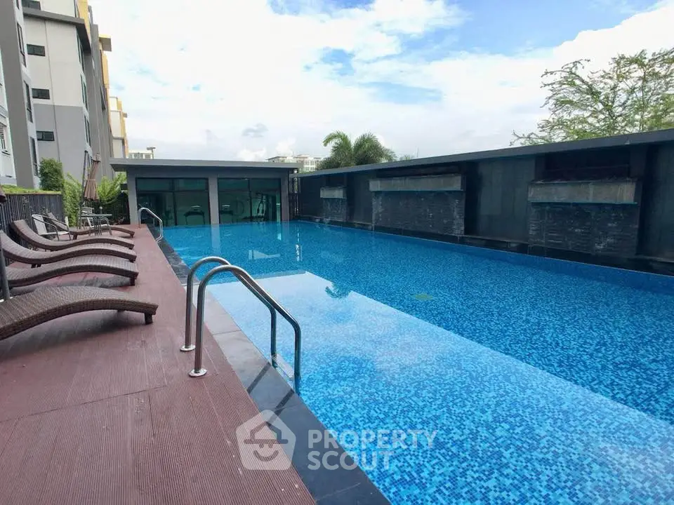 Luxurious rooftop pool with modern design and stunning city views, perfect for relaxation and leisure.
