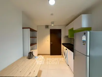 Modern kitchen with sleek appliances and ample storage space