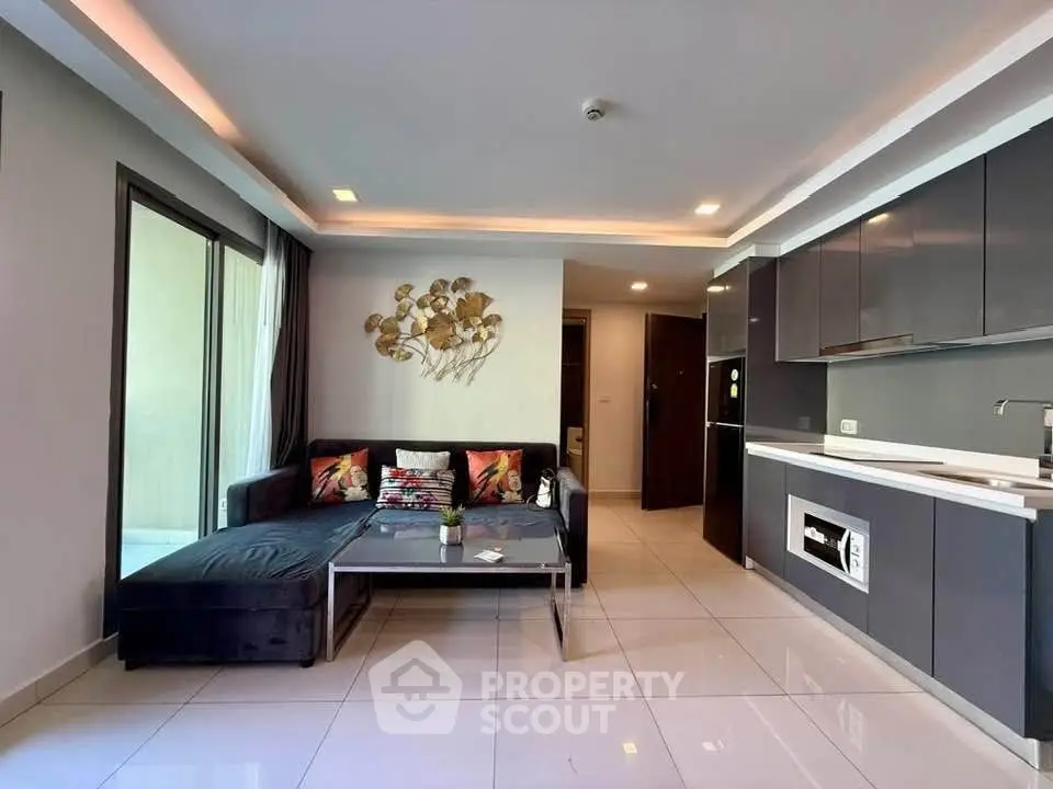 Modern living room with sleek kitchen and stylish decor