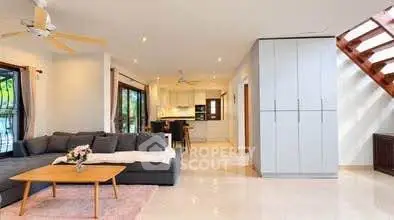 Spacious modern living room with open kitchen and stylish decor