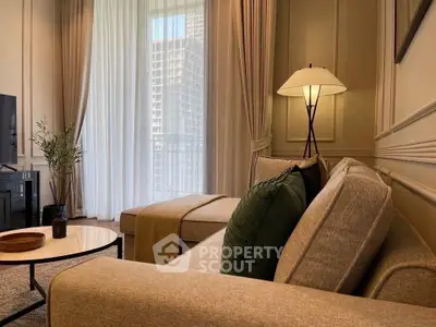 Elegant living room with cozy sofa and stylish floor lamp, perfect for relaxation.
