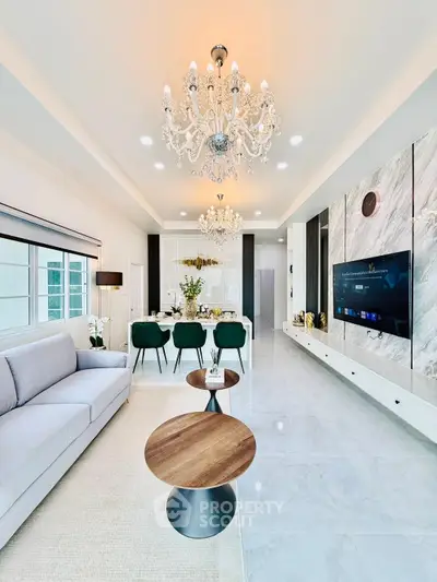 Luxurious living room with elegant chandeliers and modern decor