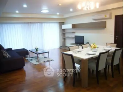 Spacious modern living room with dining area and elegant decor