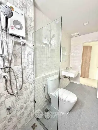 Modern bathroom with glass shower and sleek fixtures