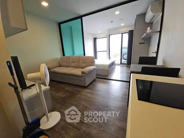 Modern living room with open layout and stylish furniture in a cozy apartment.