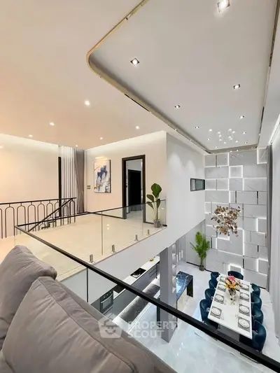Luxurious modern living room with high ceilings and elegant dining area