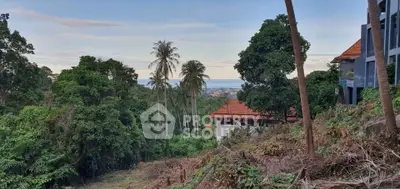 Scenic view of lush greenery and distant ocean from a hillside property, perfect for tranquil living.
