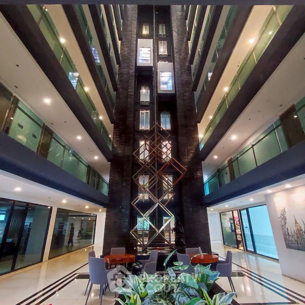 Modern building interior with stylish elevator and seating area