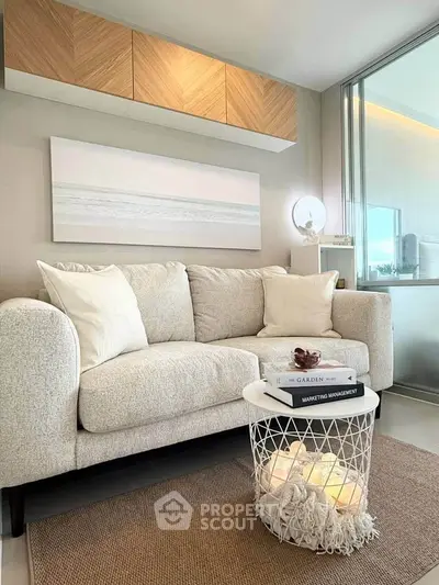 Modern living room with cozy sofa, stylish decor, and soft lighting, perfect for relaxation and comfort.