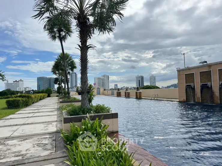 Stunning rooftop pool with city skyline view and lush greenery