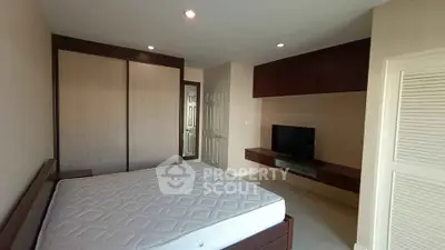 Spacious bedroom with modern design and built-in wardrobe