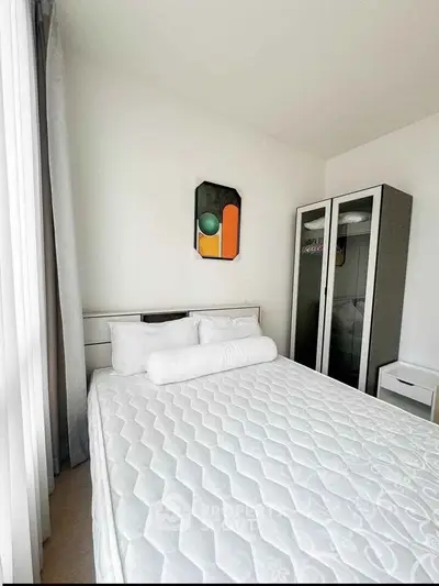 Modern bedroom with minimalist decor and large wardrobe, perfect for urban living.