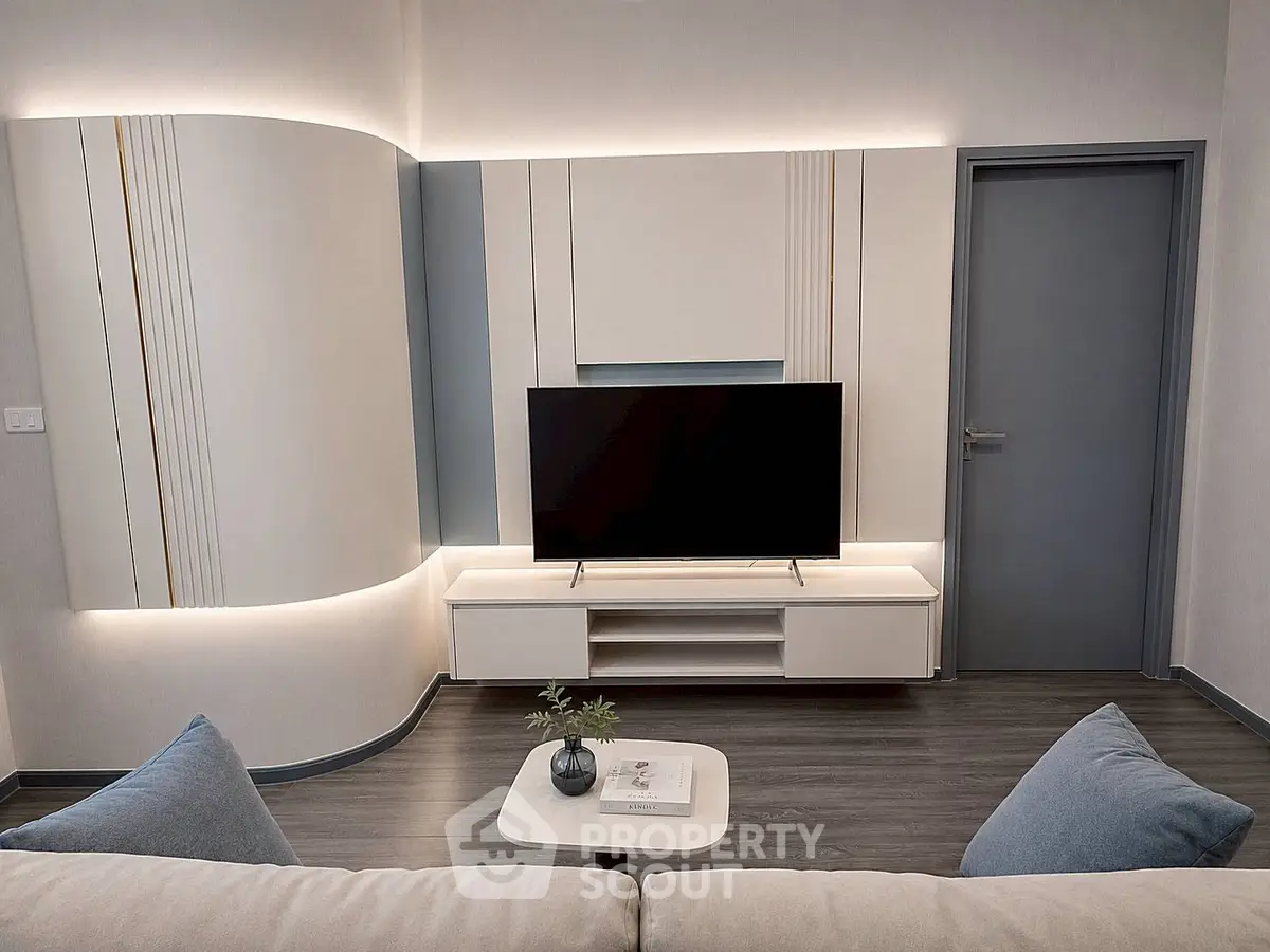 Modern living room with sleek TV setup and stylish decor